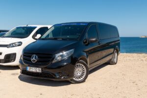 Black Mercedes van for private transfers in Milos